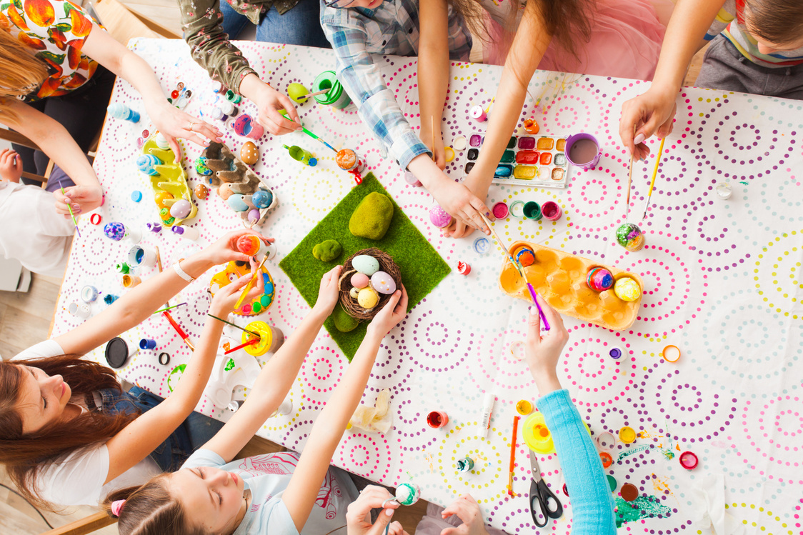 Top View Kids Hands with Easter Crafts